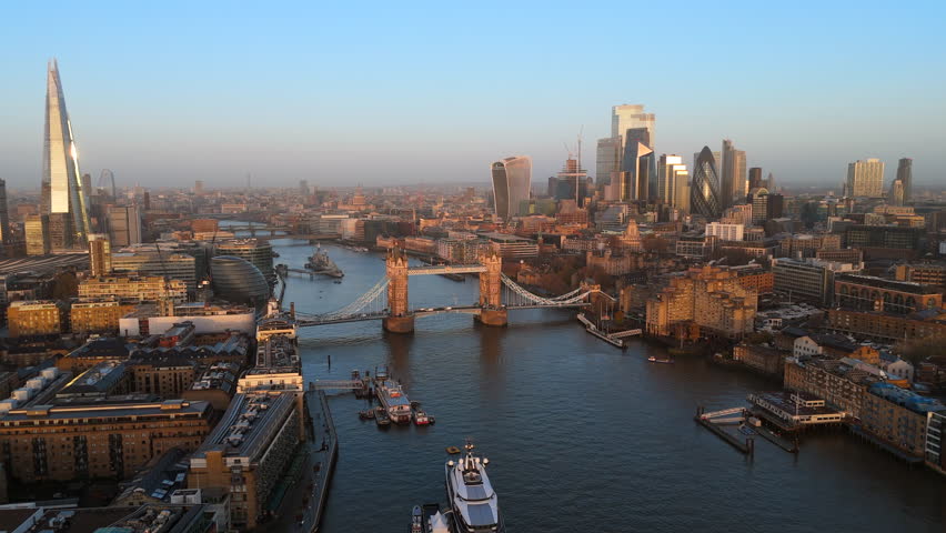 Beautiful morning Drone shot over the Tower bridge in London, by the river Themes, with scenic skyscrapers on a background, England, United Kingdom Royalty-Free Stock Footage #3435364837