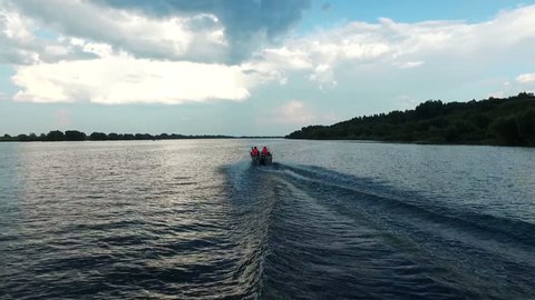 Rescuers on Boat Rushing to Help at Beach