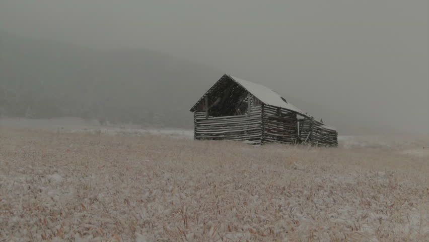 Open Space Evergreen Colorado first snow grassy field red brown horse barn aerial drone fall autumn winter blizzard snowy Rocky Mountain front range Denver historic town slider right motion