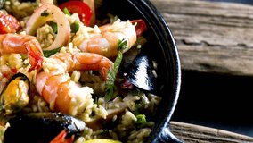 Delectable 4K Ultra HD Video: Close-Up of Succulent Seafood Paella | Culinary Masterpiece in Exquisite Detail
