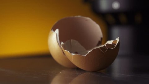 Cracked Egg Shells falls on table