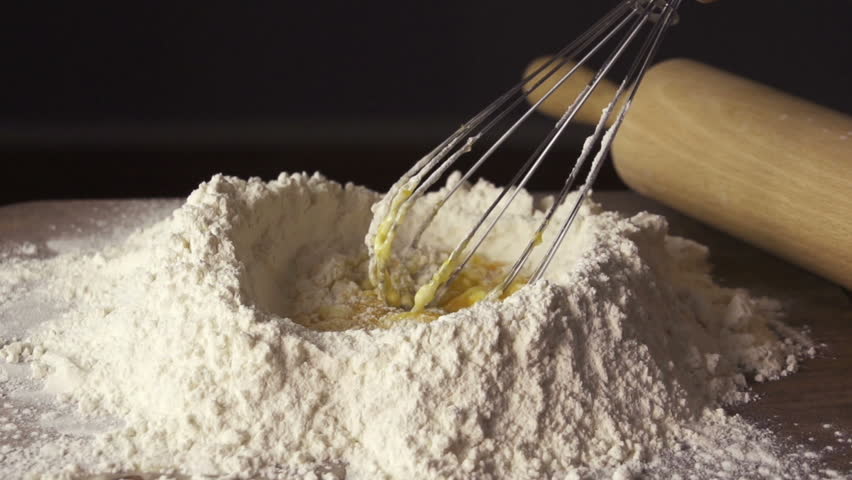Eggs and flour mixed with an hand whisk