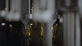 Closeup filling process of glass bottles