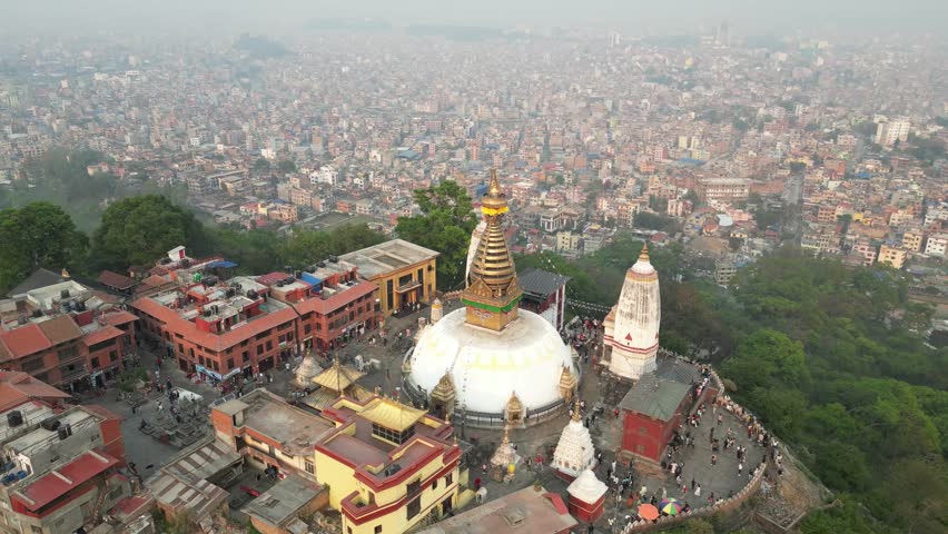 aerial drone shot of monkey temple In Kathmandu, Nepal at the base of the Himalayas