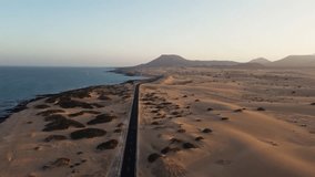 Aerial view of road crossing Corralejo Dunes Natural Park, Fuerteventura, Canary Islands, Spain. Alzada beach.