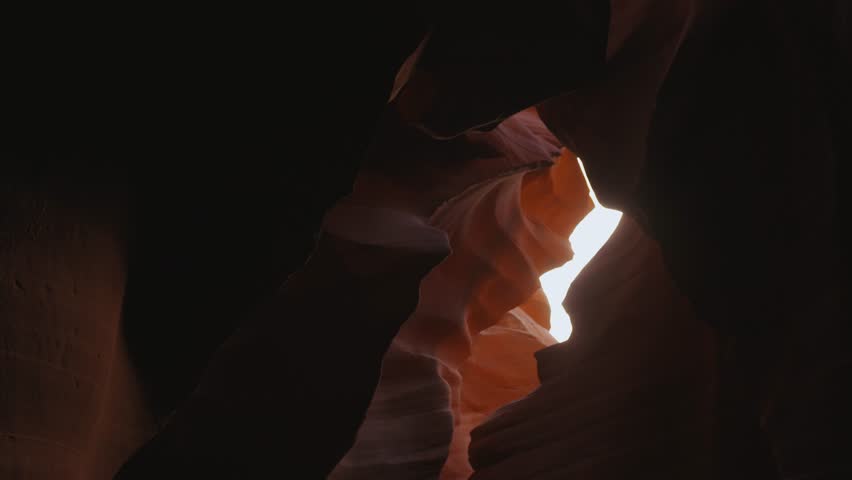 Antelope Canyon in Arizona, movement at beautiful and smooth wavy red sandstone walls. Royalty-Free Stock Footage #3435822769