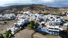 Aerial drone video of small picturesque main village or hora in island of Schoinousa, small Cyclades, Greece
