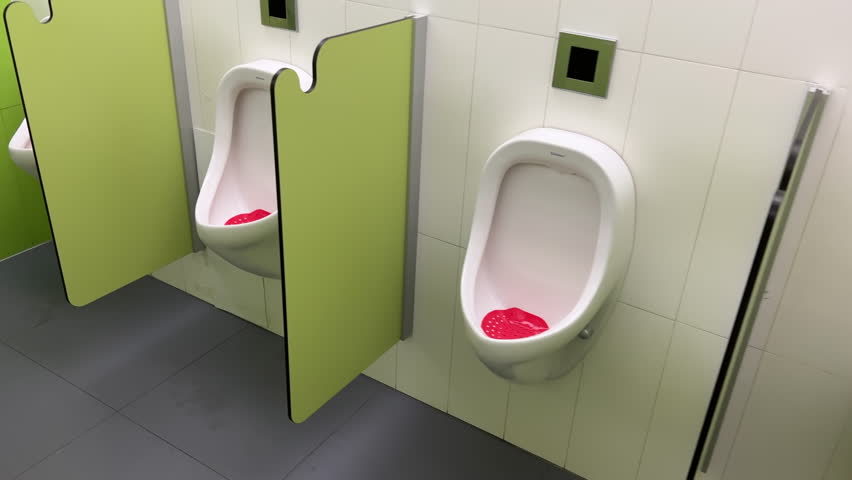 Rows of modern urinals with a sensor WC flush in a public men