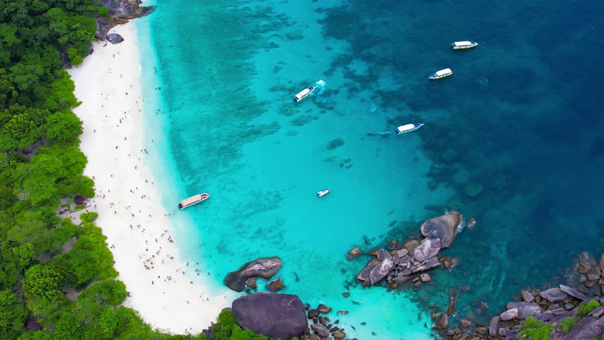 Aerial view of the Similan Islands, Andaman Sea, natural blue waters, tropical sea of Thailand. the beautiful scenery of the island is impressive. Royalty-Free Stock Footage #3436129223
