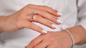 Beautiful woman holding a solitaire diamond ring, close-up shot, Valentine's Day gift - Powered by Shutterstock - Get 15% off with code: PIKWIZARD15