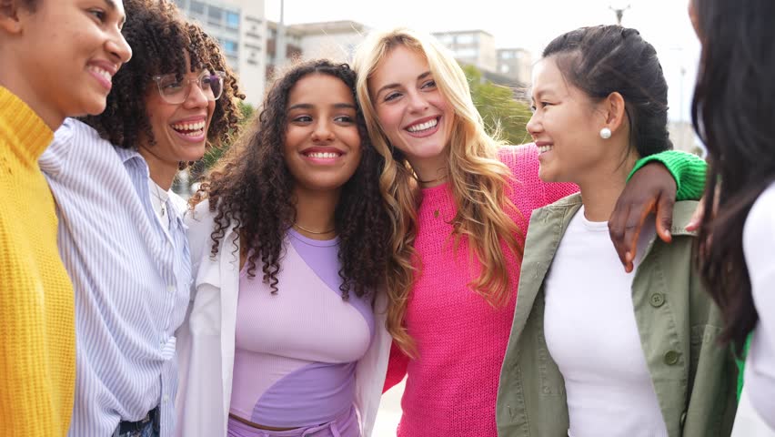 Multi ethnic group of young women hugging outside - Happy girlsfriends having fun laughing out loud on city street - Female community concept with cheerful girls standing together - 4k video  Royalty-Free Stock Footage #3436345701