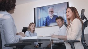 Workers team analyzing report data with team lead in remote videocall. Business company workers discussing analytics with elderly ceo in online teleconference - Powered by Shutterstock - Get 15% off with code: PIKWIZARD15