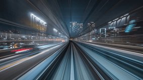 Motion timelapse POV shot from automated train at night in Tokyo, Japan. - Powered by Shutterstock - Get 15% off with code: PIKWIZARD15