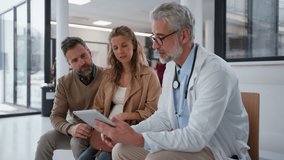 Doctor explaining results of MRI scan of brain to couple, delivering good news. Diagnosis of diseases and head injuries. - Powered by Shutterstock - Get 15% off with code: PIKWIZARD15