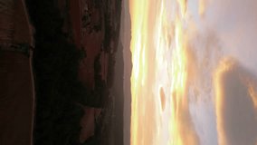 Beautiful orange sunrise above the agriculture fields in Catalonia, province of Barcelona. Vines field. In Background famous Montserrat Mountains. Drone panning left. Underexposed video. Vertical  - Powered by Shutterstock - Get 15% off with code: PIKWIZARD15