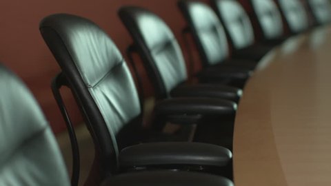 An empty executive corporate boardroom, ready for a business or shareholder meeting. ProRes file, shot in 4K UHD.