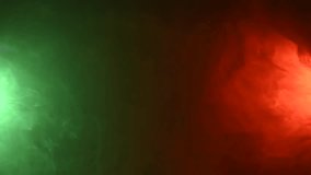 Red green smoke on a black background. Vertical video. - Powered by Shutterstock - Get 15% off with code: PIKWIZARD15