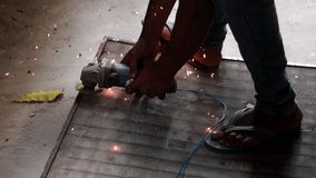HD Video : Metal worker repairing iron gate at construction site