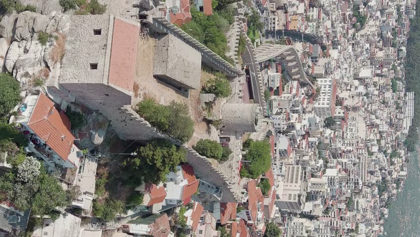 Vertical video. Kavala, Greece. Kavala Fortress. Historic city center. Aegean Sea. Summer, Aerial View, Point of interest