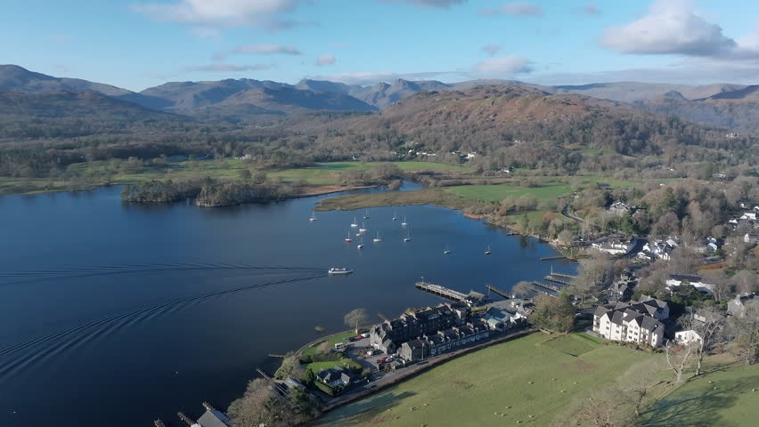 Aerial footage of Ambleside, Lake Windermere, Lake District National Park, Cumbria, England