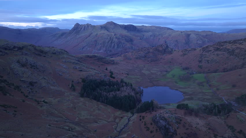 Aerial evening view over Blea Tarn and the Langdale Pikes, Lake District National Park, Cumbria, England