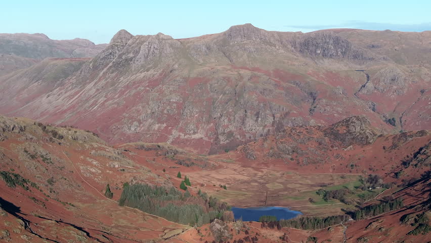 Aerial evening view over Blea Tarn and the Langdale Pikes, Lake District National Park, Cumbria, England