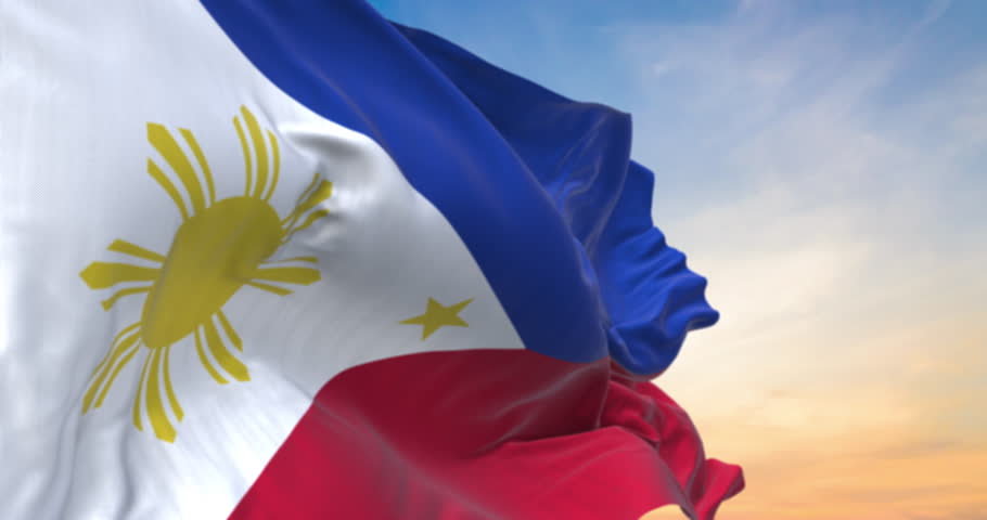 Detailed close up of the national flag of Philippines waving in the wind on a sundown, seamless loop and slow motion animation