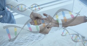 Animation of dna strands over diverse female doctor massaging hand of senior female patient. Physiotherapy, data, digital interface, connection, hospital and healthcare, digitally generated video.