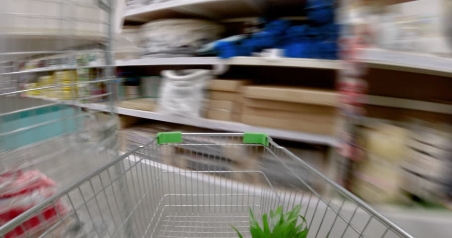Construction hypermarket. Megamall of goods for home and construction. Narrow high aisles. A customer rolls a cart. Special effect. Hyperlapse loop POV video Royalty-Free Stock Footage #3436953137