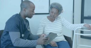 Animation of element diagram, african american male doctor with tablet and senior female patient. Consultation, digital interface, communication, hospital and healthcare, digitally generated video.