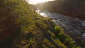 FPV Aerial shot flying a River Flowing Through a Verdant Forest in mountain. FPV Dynamic drone shot - Powered by Shutterstock - Get 15% off with code: PIKWIZARD15