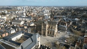 Basilica Saint-Aubin in Place Sainte Anne square and Jacobins convent, Rennes in France.Aerial tilt down forward