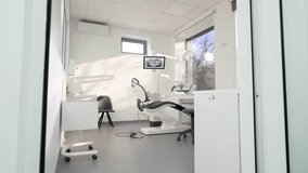 Dentistry office with professional modern equipment. Empty minimalistic stomatology office with dental unit, chair and professional equipment. Dental chair in the medical clinic. Workplace of dentist. - Powered by Shutterstock - Get 15% off with code: PIKWIZARD15