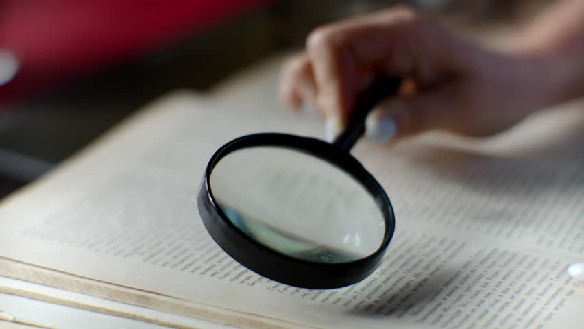 Woman Reading Book With Magnifying Glass. Library Investigation Magnifier. Looking Through Magnifying Glass To Documents. Research Studying Book. Book Reading On Magnifying Glass. Literature Magnifier