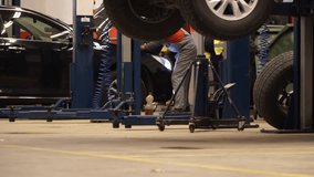 Car repair servise scenes – car repairs - replacement of spare parts and maintenance - 4k video