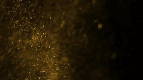 Gold dust particles fly in slow motion in the air lingering slowly. Dust Particles Background Bokeh Lights Background on Black Background 4k Footage Snow Particles Background. - Powered by Shutterstock - Get 15% off with code: PIKWIZARD15