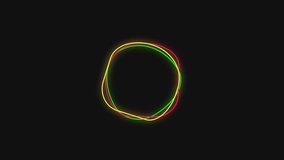 Animated multi color rotating circular light element on black screen background.