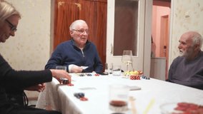 Family Enjoying Card Game Night with Snacks and Drinks at Home - Powered by Shutterstock - Get 15% off with code: PIKWIZARD15