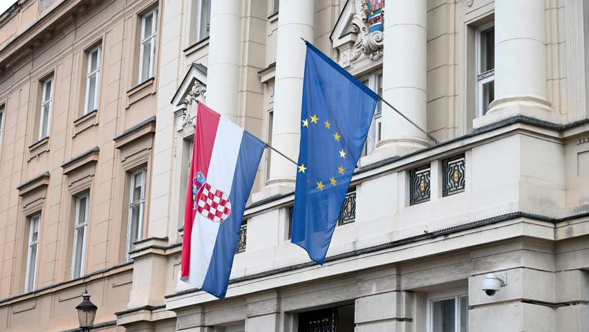 Zagreb, Croatia: Croatian Parliament or Hrvatski sabor on St. Marks Square. Flags of European Union na Republic of Croatia. EU and Croatian flags. 