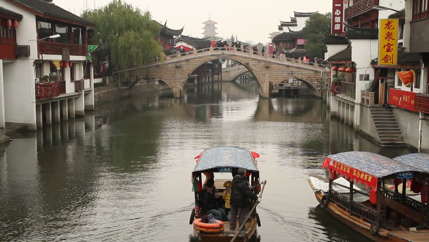 SHANGHAI - DECEMBER 22: Qibao Ancient Town traditional bridge and wooden boat,