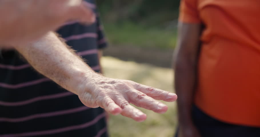 Hands, together for stack and team building with people outdoor, support and solidarity in nature. Community, mission and partnership, trust and commitment with loyalty, group huddle and agreement Royalty-Free Stock Footage #3437456607
