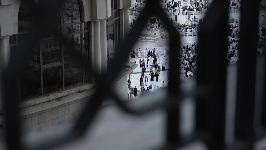 view from the top floor of the many Umrah pilgrims in the Kaabah courtyard