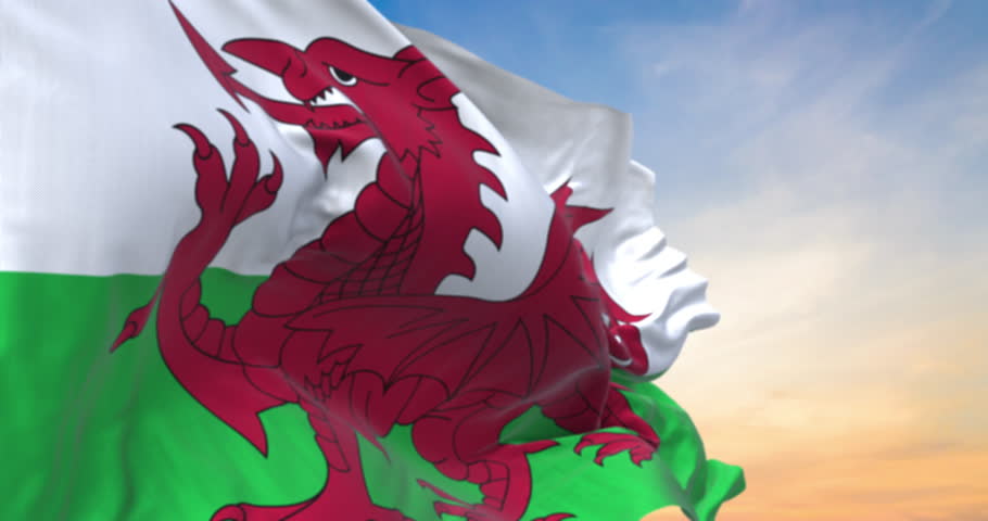 Detailed close up of the national flag of Wales waving in the wind on a sundown, seamless loop and slow motion animation Royalty-Free Stock Footage #3437568659