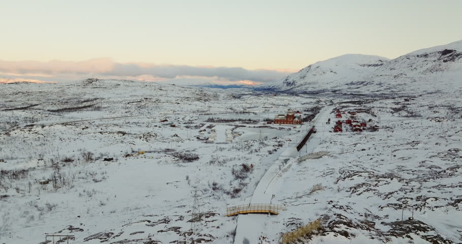 Arctic Train Journey: Transport Train Halting at Snowy Station in Norway