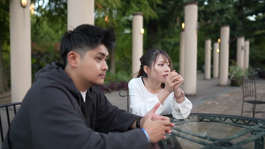 A young Japanese couple in their 20s spending time in the streets of Nagoya City, Aichi Prefecture