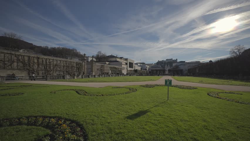 Salzubrg, Austria. Mirabell Palace and Gardens on sunny spring day. Park von Schloss Mirabell, Salzburg, Osterreich. Schloss Mirabell in der Salzburger Rechten Altstadt. 