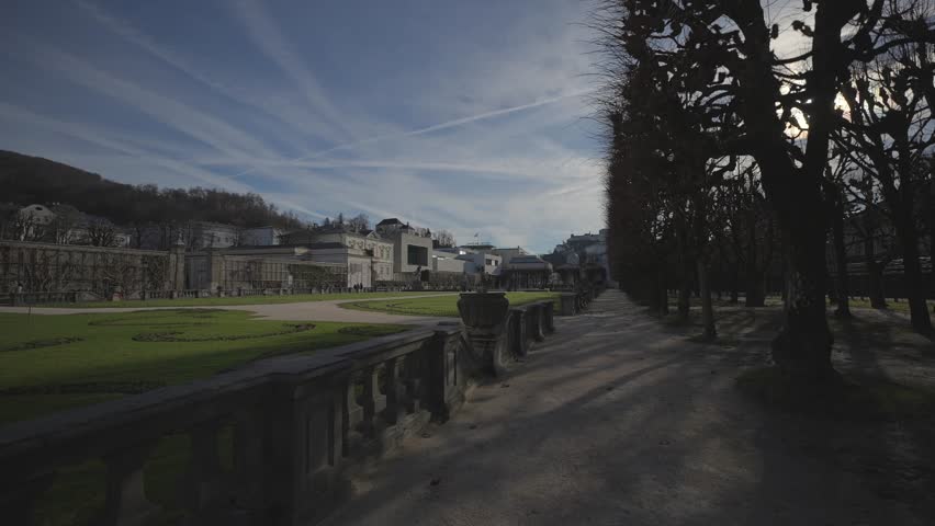 Salzubrg, Austria. Mirabell Palace and Gardens on sunny spring day. Park von Schloss Mirabell, Salzburg, Osterreich. Schloss Mirabell in der Salzburger Rechten Altstadt. 