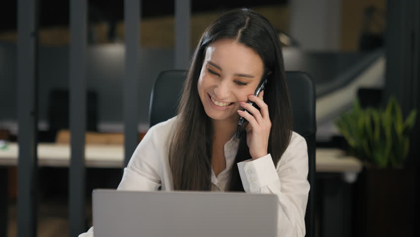 Business corporate work emotional smiling businesswoman working with computer talking mobile phone woman office worker manager consultant multitasking typing laptop answer call smartphone talk loud Royalty-Free Stock Footage #3437877537
