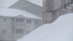 View of the window of a residential wooden house during a heavy snow storm in the city of Dautmouth, Canada. February. 2024. Heavy snowfall and gusty winds covered cars and roads in the city. - Powered by Shutterstock - Get 15% off with code: PIKWIZARD15
