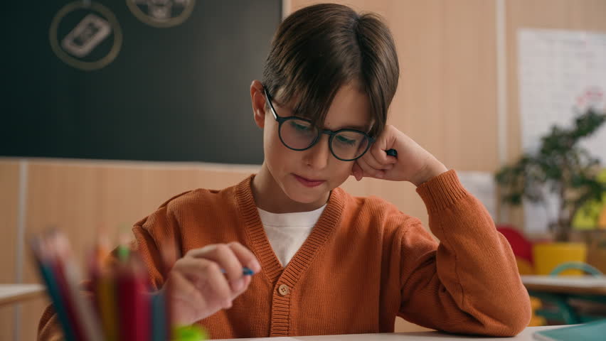 Caucasian guy boy think find idea ponder difficult task writing notes math exercise class lesson school learn write copybook kid schoolboy child pupil thinking studying primary education rise finger Royalty-Free Stock Footage #3437905177